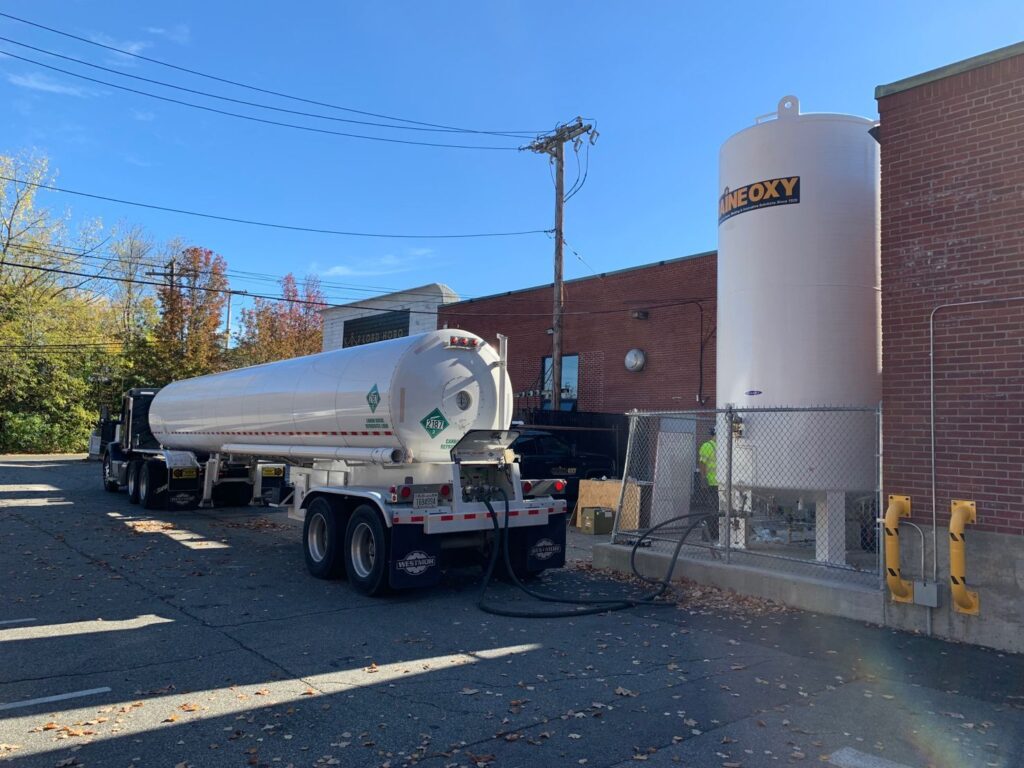 tractor trailer delivering bulk gas to maine oxy gas storage silo