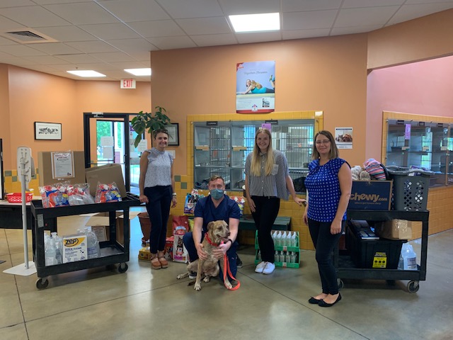 animal shelter employees with dog