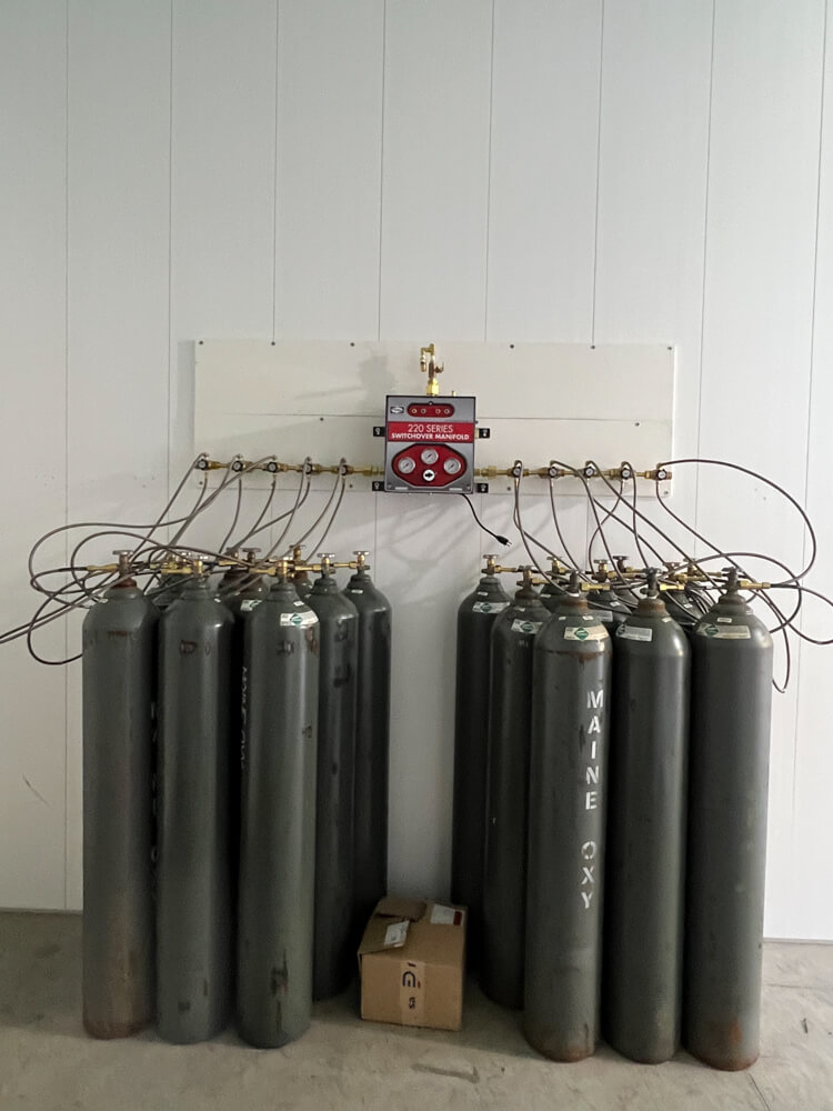 gas cylinders attached to manifold for refilling
